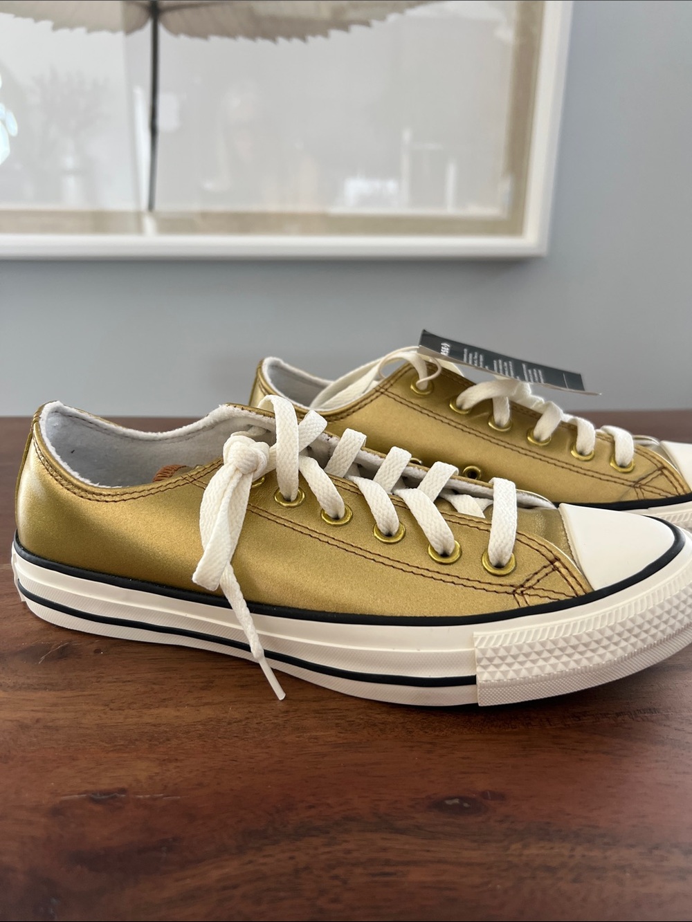 Converse Low-Top Sneakers in Metallic Gold and White